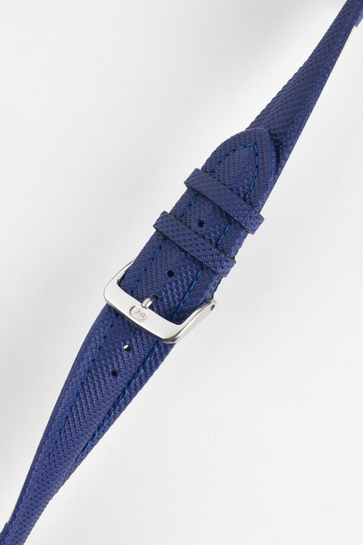 Blue Di-Modell Traveller leather watch strap shown fastened with a polished stainless steel buckle on a white background. Features a textured leather finish, matching blue keepers, tonal blue stitching, multiple adjustment holes, and a tapered pointed tip for a smart, contemporary look.