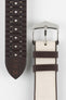 Beige textile-effect watch strap shown to display both the woven-look outer surface and brown rubber underside. Features a silver-tone buckle, brown edges, and a patterned rubber backing on a white background.