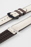 Beige textile-effect watch strap with brown rubber backing and a black buckle, shown in separate sections on a white background. Features a woven-look surface, brown edges, and a patterned rubber underside.