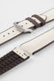 Beige textile-effect watch strap with brown rubber backing and a brushed silver-tone buckle, shown in separate sections on a white background. Features a woven-look surface, brown edges, and a patterned rubber underside.