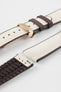 Beige textile-effect watch strap with brown rubber backing and a rose gold-tone deployment clasp, shown in separate sections on a white background. Features a woven-look surface, brown edges, and a patterned rubber underside.