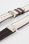 Light blue textile-effect watch strap with navy rubber backing and a black buckle, shown in separate sections on a white background. Features a textured woven-look surface, navy edges, and a patterned rubber underside.