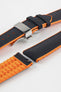 Black textile-effect watch strap with bright orange rubber backing and a silver-tone deployment clasp, shown in separate sections on a white background. Features a textured woven-look surface, orange edges, and a patterned rubber underside.