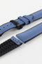 A detailed, slightly angled shot of a blue Hirsch Arne Performance Watch Strap, laid in two pieces on a white background, highlighting its woven blue upper, black ribbed underside, and a black deployment clasp.