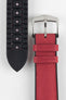 A detailed close-up of a burgundy Hirsch Arne Performance watch strap laid out on a white surface. The image clearly shows the textured red fabric on the top, the black rubberized underside with ventilation channels and the word "Arne" and "20" embossed, and the polished silver buckle.