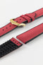 A burgundy Hirsch Arne Animal-Free Sailcloth Effect Performance Watch Strap is displayed on a white background, showcasing the strap's full length and a gold pin buckle. The textured sailcloth-like material of the strap is also clearly visible, along with the black rubberized underside.