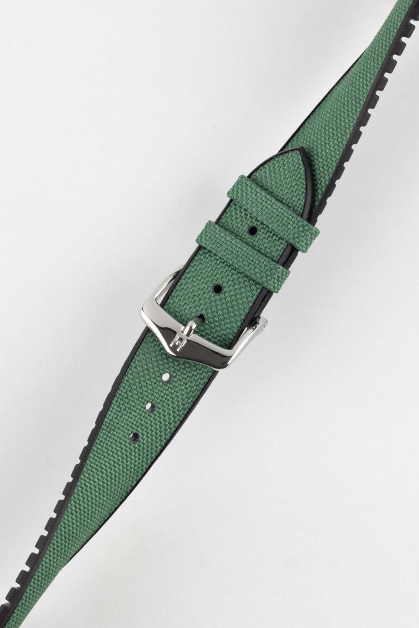 A diagonal close-up of a dark green Hirsch Arne Animal-Free Sailcloth Effect Performance watch strap with a polished silver pin buckle, set against a bright white background. The textured surface of the green strap and the black lining are clearly visible.