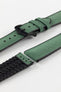 A Hirsch Arne Dark Green Animal-Free Sailcloth Effect Performance Watch Strap is displayed, showcasing the strap's full length and a matte black pin buckle. The textured sailcloth-like material of the dark green strap is clearly visible, along with the black rubberized underside.