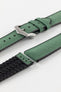 A Hirsch Arne Dark Green Animal-Free Sailcloth Effect Performance Watch Strap is displayed, showcasing the strap's full length and a brushed silver pin buckle. The textured sailcloth-like material of the dark green strap is clearly visible, along with the black rubberized underside.