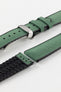 A Hirsch Arne Dark Green Animal-Free Sailcloth Effect Performance Watch Strap is displayed, showcasing the strap's full length and a polished silver deployment clasp. The textured sailcloth-like material of the dark green strap is clearly visible, along with the black rubberized underside.