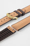 Golden brown textile-effect watch strap with brown rubber backing and a gold-tone buckle, shown in separate sections on a white background. Features a woven-look surface, brown edges, and a patterned rubber underside.