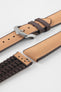 Golden brown textile-effect watch strap with brown rubber backing and a silver-tone buckle, shown in separate sections on a white background. Features a woven-look surface, brown edges, and a patterned rubber underside.
