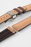 Golden brown textile-effect watch strap with brown rubber backing and a silver-tone deployment clasp, shown in separate sections on a white background. Features a woven-look surface, brown edges, and a patterned rubber underside.
