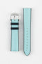 Ice blue textile-effect watch strap with a silver-tone buckle, displayed in two separate pieces on a white background. Features black edges, a woven-look texture, and multiple adjustment holes.