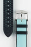Ice blue textile-effect watch strap shown to display both the woven-look outer surface and black rubber underside. Features a silver-tone buckle, black edges, and a patterned rubber backing on a white background.
