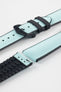 Ice blue textile-effect watch strap with black rubber backing and a black buckle, shown in separate sections on a white background. Features a woven-look surface, black edges, and a patterned rubber underside.