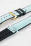 Ice blue textile-effect watch strap with black rubber backing and a gold-tone deployment clasp, shown in separate sections on a white background. Features a woven-look surface, black edges, and a patterned rubber underside.