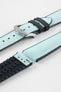 Ice blue textile-effect watch strap with black rubber backing and a silver-tone buckle, shown in separate sections on a white background. Features a woven-look surface, black edges, and a patterned rubber underside.