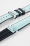 Ice blue textile-effect watch strap with black rubber backing and a silver-tone deployment clasp, shown in separate sections on a white background. Features a woven-look surface, black edges, and a patterned rubber underside.