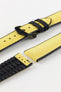 Detailed view of a Hirsch Arne watch strap, featuring a bright yellow sailcloth-textured surface with black leather accents and a black pin buckle. The strap is partially detached, showing the pin mechanism.