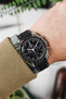Omega Speedmaster Moonwatch Black Dial fitted with Hirsch Bologna in Black worn on wrist with sweatshirt and shirt