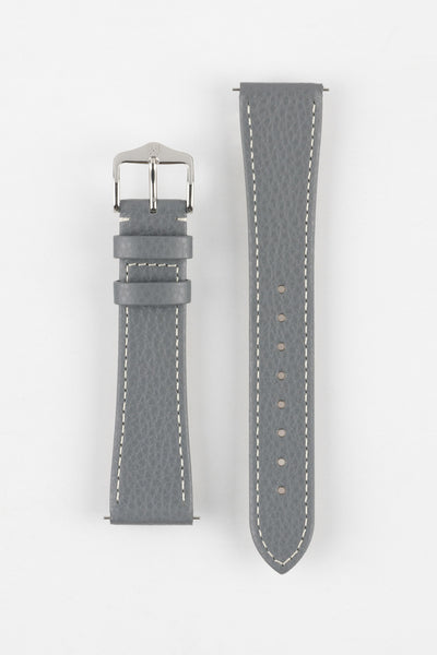 Product shot of a grey textured leather watch strap displayed against a white background, showing both sections separately: one with a polished silver-tone pin buckle and two keepers, and the other with a pointed tip and multiple adjustment holes, highlighting the white contrast stitching and fine grain texture.