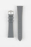 Product shot of a grey textured leather watch strap displayed against a white background, showing both sections separately: one with a polished silver-tone pin buckle and two keepers, and the other with a pointed tip and multiple adjustment holes, highlighting the white contrast stitching and fine grain texture.