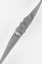 Close-up of a grey textured leather watch strap with white contrast stitching, featuring a polished silver-tone pin buckle and two keepers, with visible adjustment holes and a subtly grained finish against a white background.