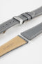 Close-up product image of a grey textured leather watch strap with white contrast stitching, displayed against a white background, featuring a polished silver-tone folding clasp and two keepers, alongside separate strap sections with exposed spring bars and a beige underside stamped with partial text “20 HIRSCH Bologna.”