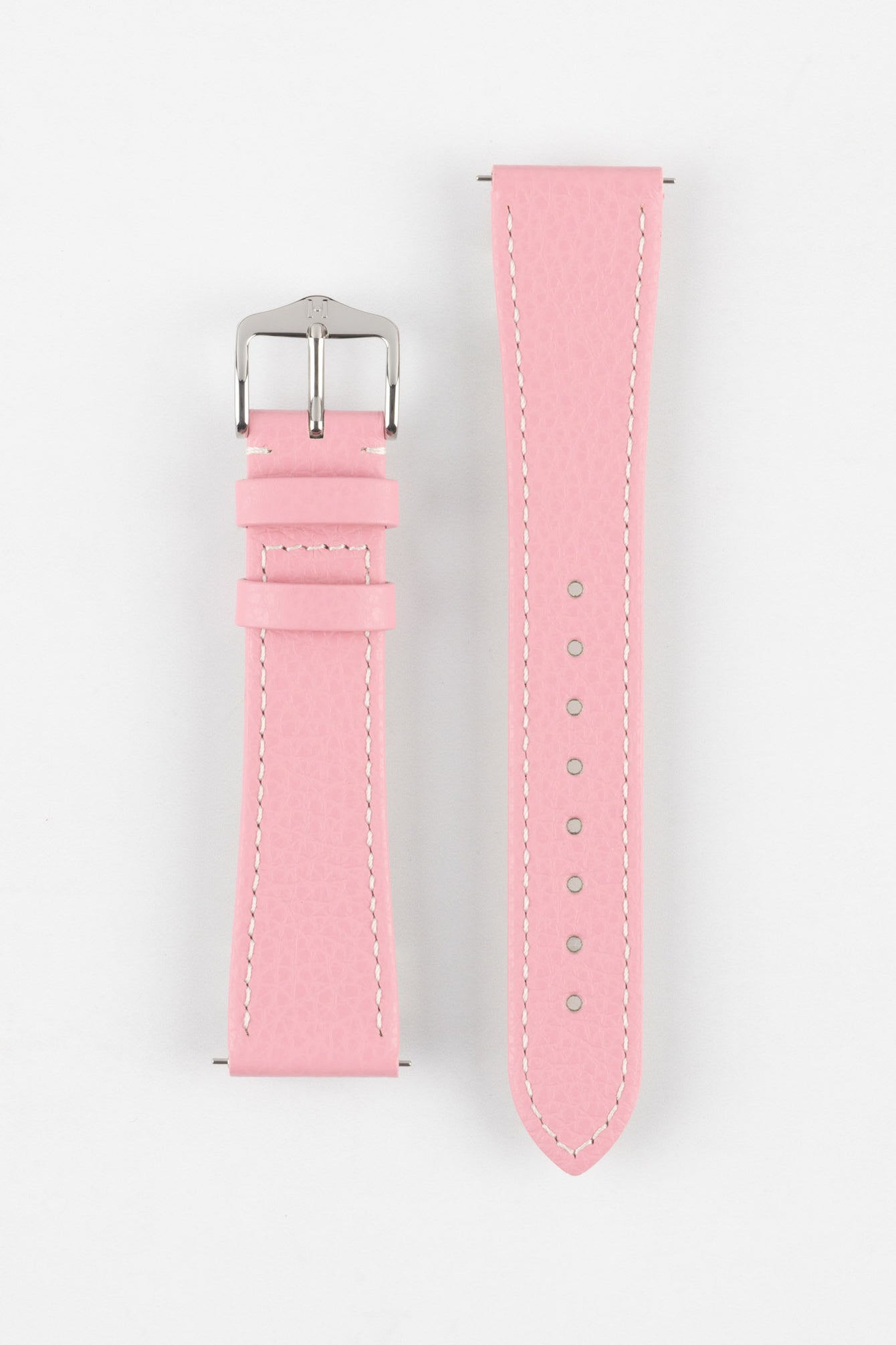 Product shot of a pink textured leather watch strap displayed against a white background, showing both sections separately: one with a polished silver-tone pin buckle and two keepers, and the other with a pointed tip and multiple adjustment holes, highlighting the white contrast stitching and fine grain texture.