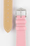 Close-up product image of a pink textured leather watch strap against a white background, showing the underside with multiple adjustment holes and beige lining on one section, and the other with a polished silver-tone pin buckle and two keepers, highlighting the white contrast stitching and fine grain texture.