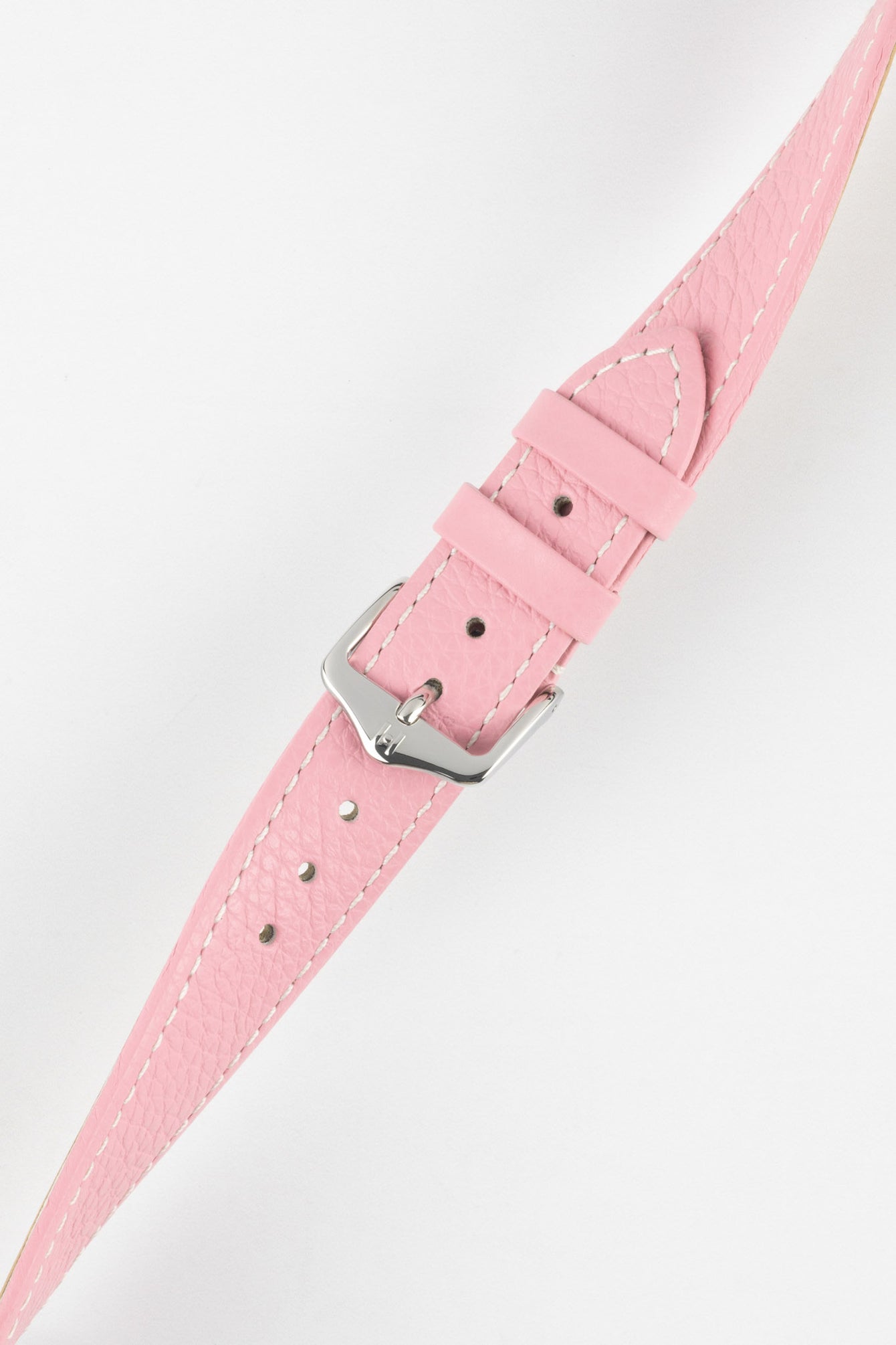 Close-up of a pink textured leather watch strap with white contrast stitching, featuring a polished silver-tone pin buckle and two keepers, with adjustment holes visible along the strap against a white background.