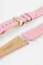Close-up product image of a pink textured leather watch strap with white contrast stitching, displayed against a white background, featuring a polished gold-tone folding clasp and two keepers, alongside separate strap sections with exposed spring bars and a beige underside stamped “HIRSCH Bologna 20.”