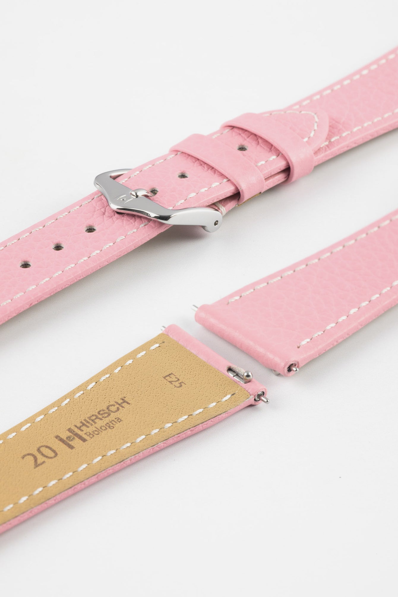 Close-up product image of a pink textured leather watch strap with white contrast stitching, displayed on a white background, featuring a polished silver-tone pin buckle and two keepers, alongside separate strap sections with exposed spring bars and a beige underside stamped “HIRSCH Bologna 20.”