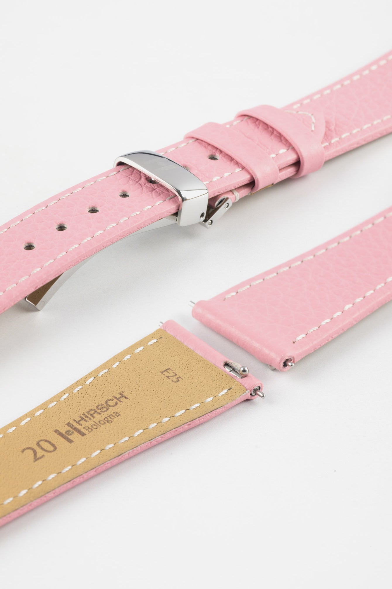 Close-up product image of a pink textured leather watch strap with white contrast stitching, displayed against a white background, featuring a polished silver-tone folding clasp and two keepers, alongside separate strap sections with exposed spring bars and a beige underside stamped “HIRSCH Bologna 20.”