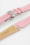 Close-up of a pink leather watch strap with white stitching and a polished silver butterfly clasp, displayed open alongside detached strap pieces with visible spring bars and a tan underside stamped with Hirsch branding, set against a plain white background.
