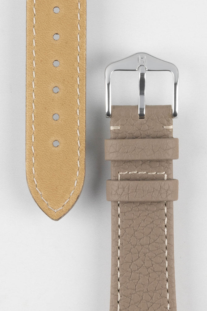 Buckle and underside of adjustment holes on Hirsch Bologna leather wach strap in Taupe