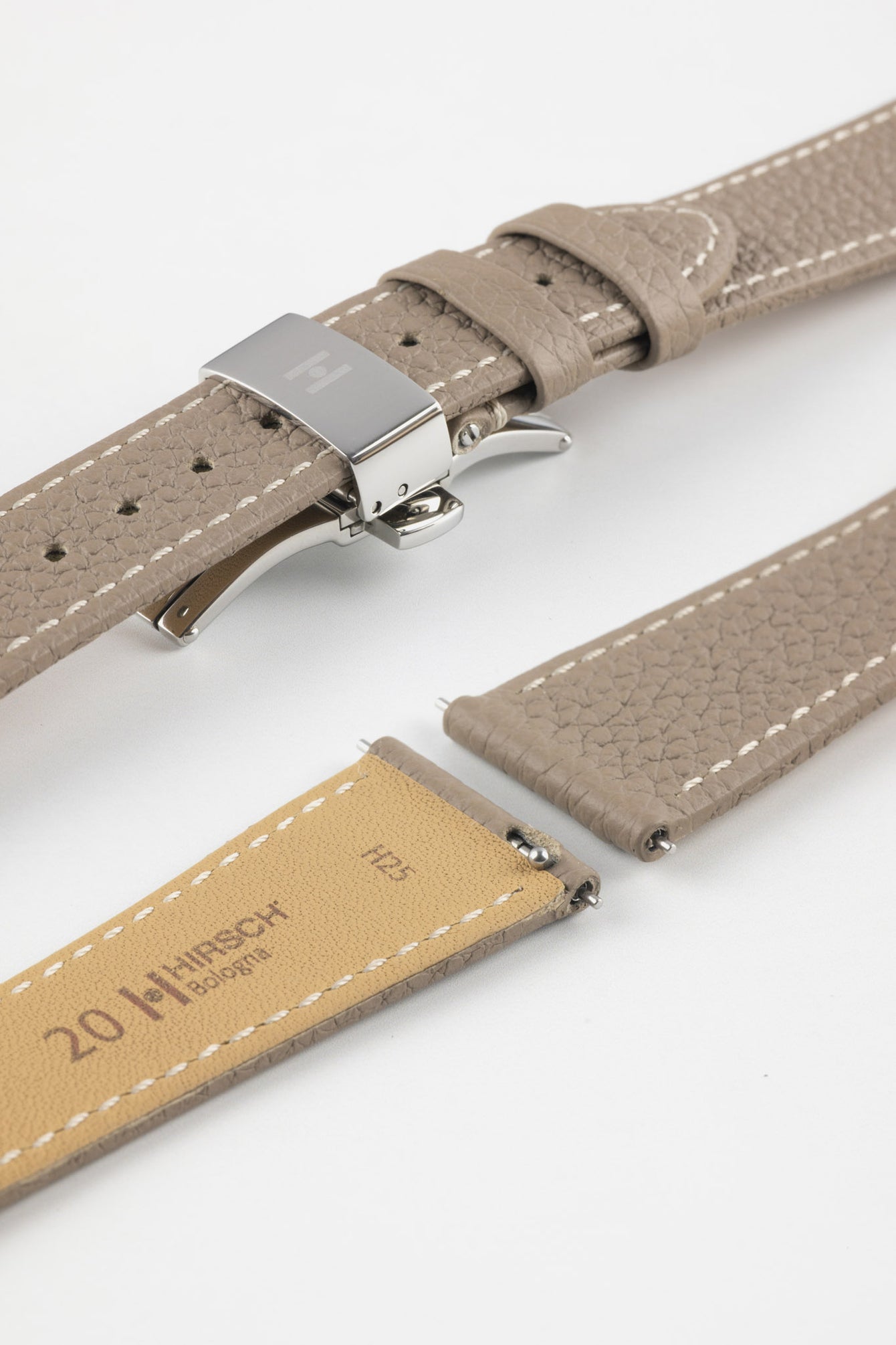 Taupe leather watch strap with a stainless steel deployant clasp, shown with a beige leather underside and white contrast stitching.