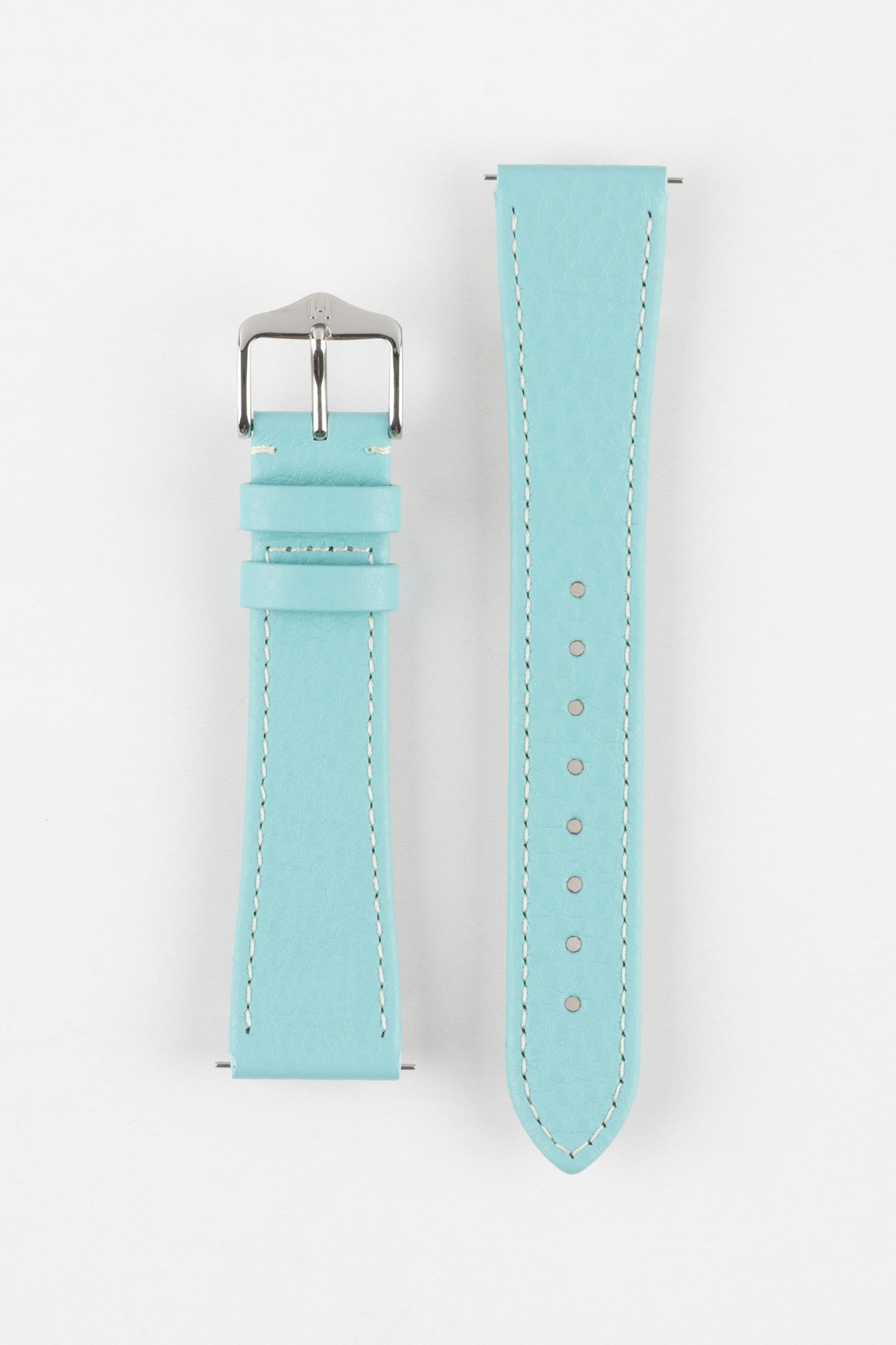 Product shot of a light turquoise-blue textured leather watch strap displayed against a white background, showing both sections separately: one with a polished silver-tone pin buckle and two keepers, and the other with a pointed tip and multiple adjustment holes, highlighting the white contrast stitching and fine grain texture.