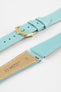 Close-up product image of a light turquoise-blue textured leather watch strap with white contrast stitching, displayed against a white background, featuring a polished gold-tone pin buckle and two keepers, alongside separate strap sections with exposed spring bars and a beige underside stamped with partial text “20 HIRSCH Bologna.”