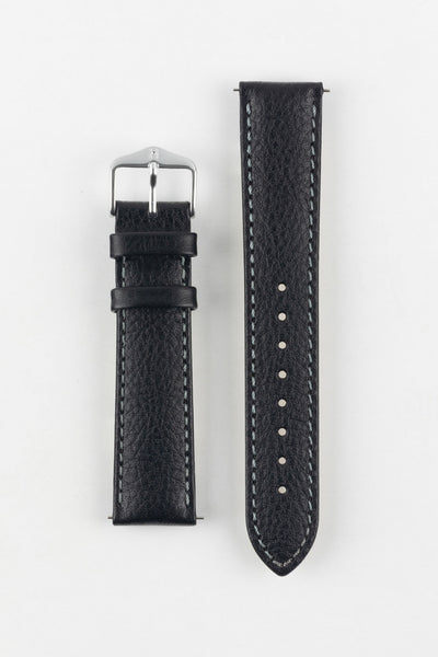 High-quality black watch strap with subtle grain texture and contrast white stitching, laid flat, with a classic silver buckle.