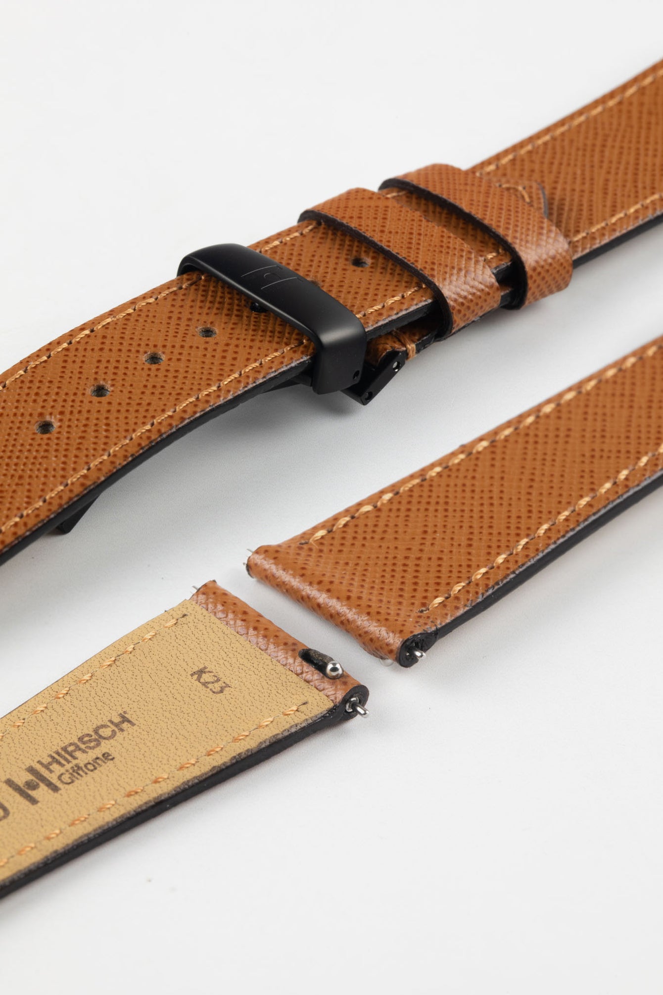 Hirsch Giffone gold brown leather strap paired with a black sport deployment clasp and quick-release pins.