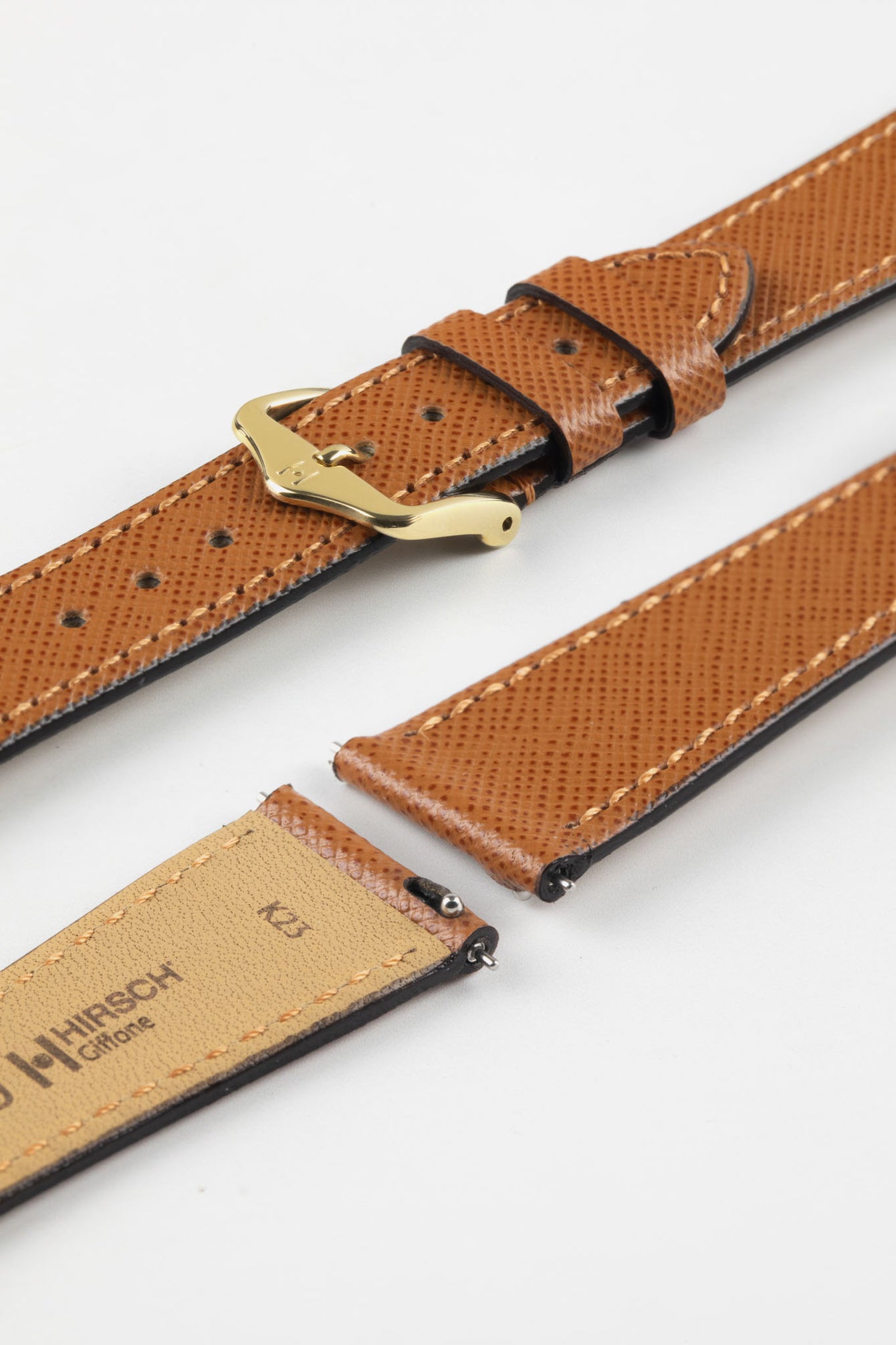 Hirsch Giffone gold brown leather strap with quick-release spring bars and a traditional gold pin buckle.