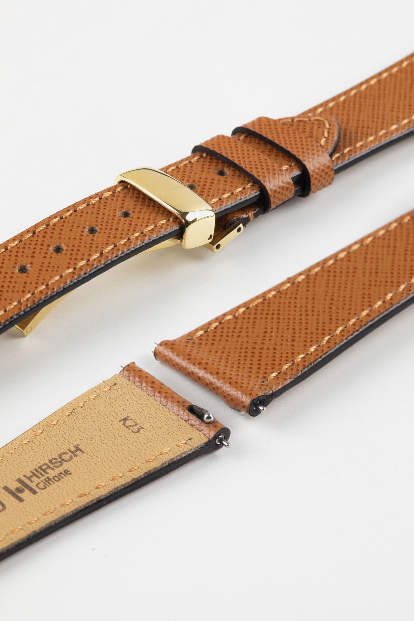 Hirsch Giffone gold brown leather strap paired with a gold sport deployment clasp and quick-release pins.