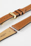 Hirsch Giffone gold brown leather strap paired with a gold sport deployment clasp and quick-release pins.