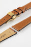 Hirsch Giffone gold brown leather watch strap fitted with a gold push-button deployment clasp.