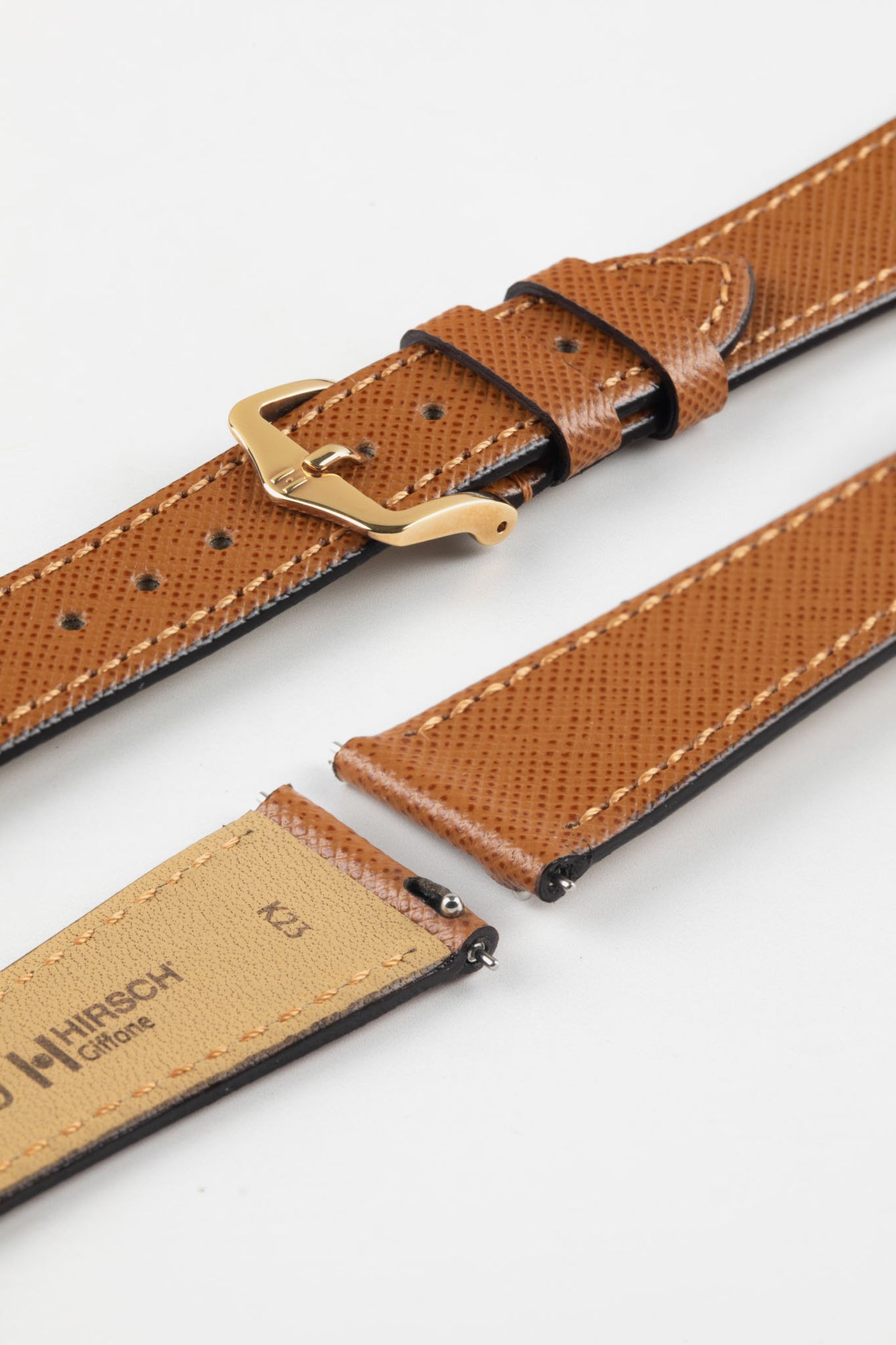 Hirsch Giffone gold brown leather strap with quick-release spring bars and a traditional rose gold pin buckle.