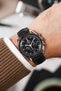 Black Omega Speedmaster Moonwatch fitted with Hirsch LONDON Black Lizard Leather Watch Strap worn on wrist