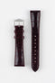Product shot of a glossy burgundy crocodile-pattern leather watch strap displayed flat against a white background, showing both halves separately: one side with a polished silver-tone pin buckle and two keepers, and the other with multiple adjustment holes, highlighting the rich shine, textured grain, and matching stitching throughout.