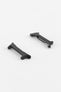 Two black adapter pieces for a watch strap, shown separated on a light grey background. Each piece features a matte finish with integrated fitting ends and a central recess for the strap attachment, highlighting their shape and construction for connecting straps to a compatible smartwatch.